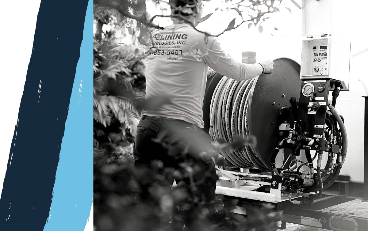 Hydro Jetting machine and technician using on a home sewer system to clean it.